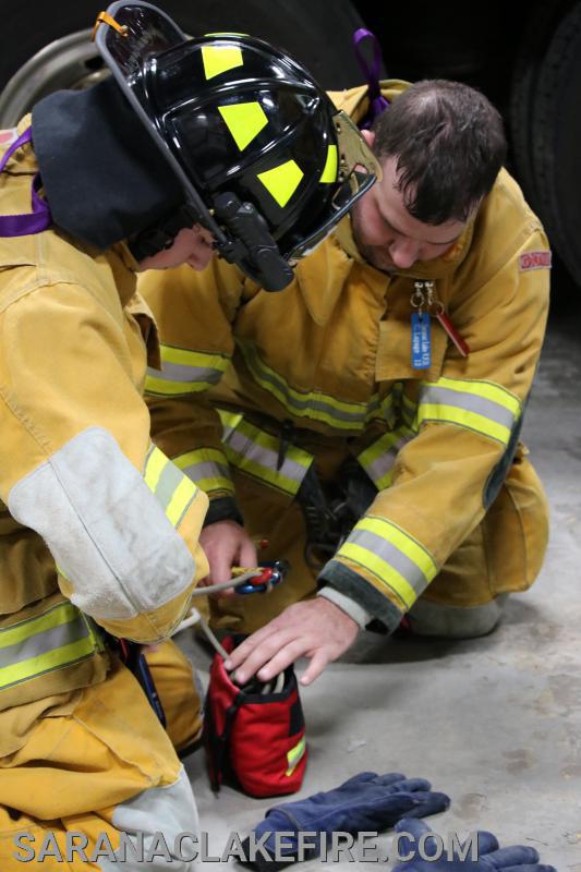 The safety rope is carefully packed in a bag specifically made to hold the rope.  The bag and rope are in the firefighters pants pocket at all times.  The rope efficiently feeds from the firefighters pocket upon his or her descent.