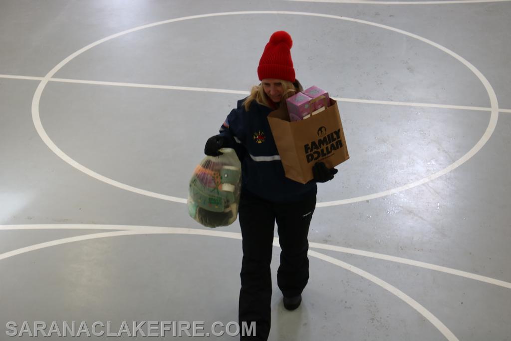 A crew of SLVFD and SLVFD auxiliary members receive toys from a generous community.
