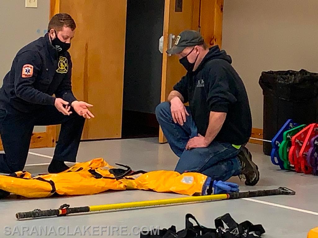 SLVFD members practice surface ice rescue techniques on dry land in a controlled setting prior to going out on the actual ice