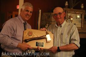 Chief Keough presents award to Andy McGill for achieving 50 years of service with the SLVFD.