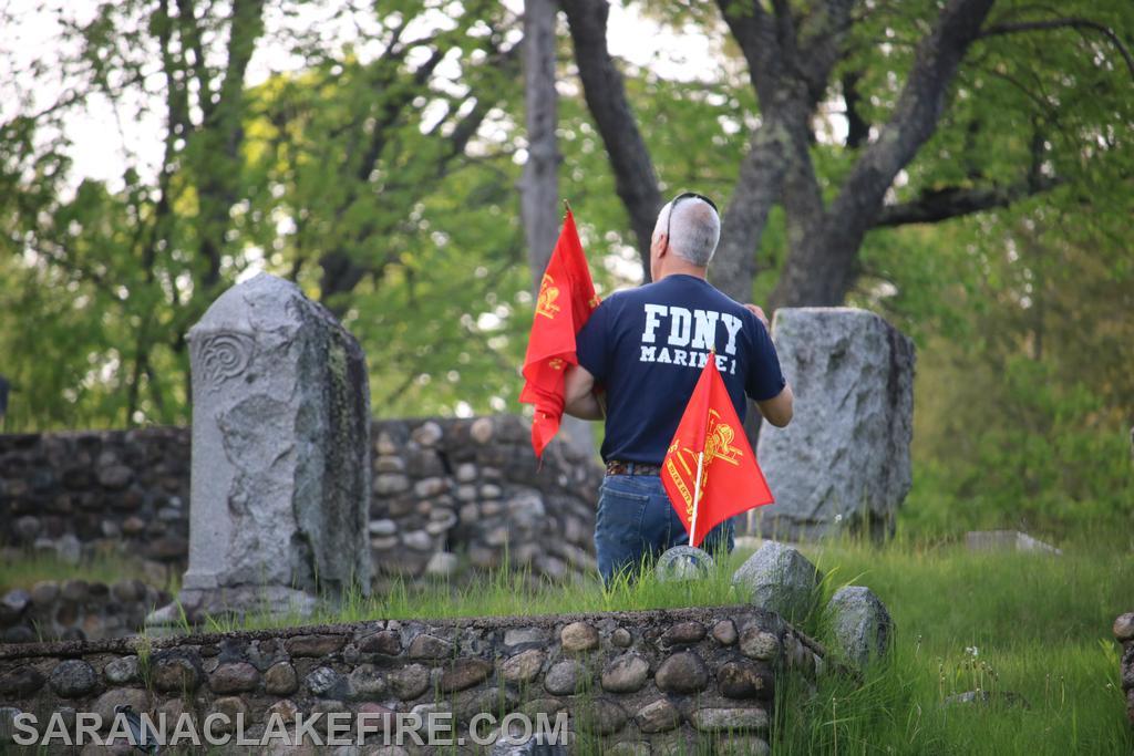 An SLVFD member decorates the graves of former SLVFD members who have passed before us.
