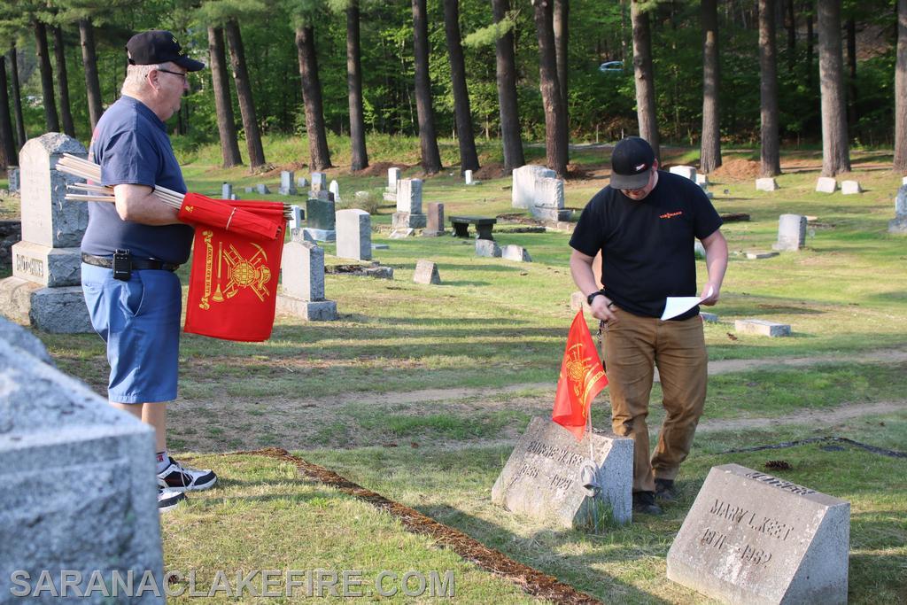 An SLVFD member decorates the graves of former SLVFD members who have passed before us.