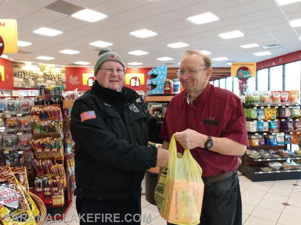 SLVFD member Gifford Hosler went on the road to the Ray Brook Maplefields to collect gifts from community member John Duquette