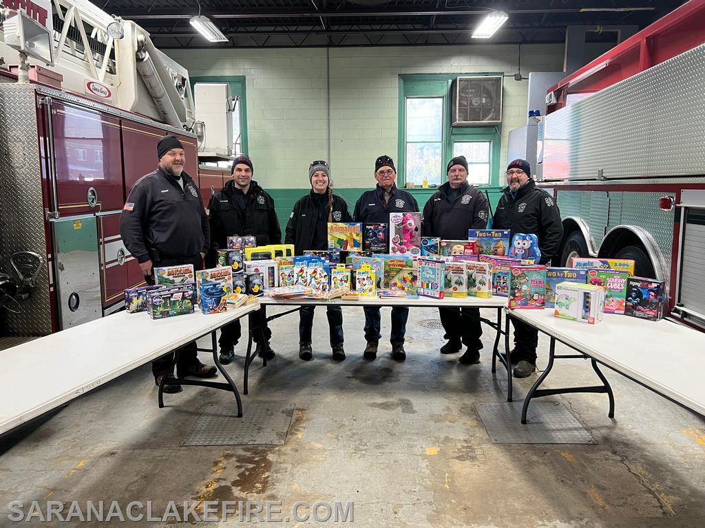 SLVFD firefighters make the first contribution of the day prior to the doors opening.  Toys courtesy of the SLVFD and Goody Goody's.